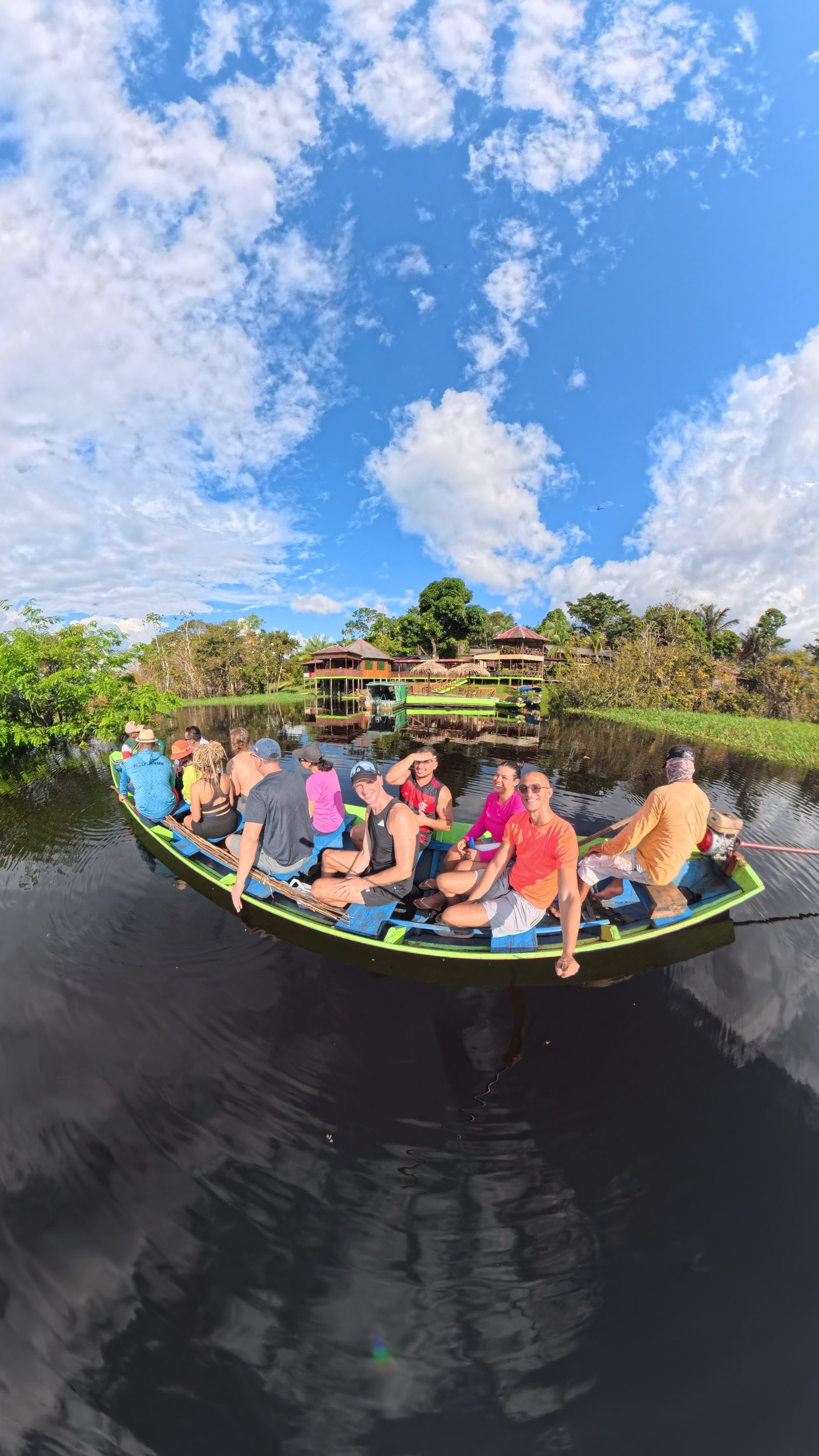 Group of travelers on a riverboat heading to the Amazon lodge